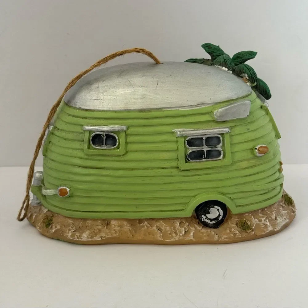 decorative resin RV camper birdhouse with a flamingo and a palm tree